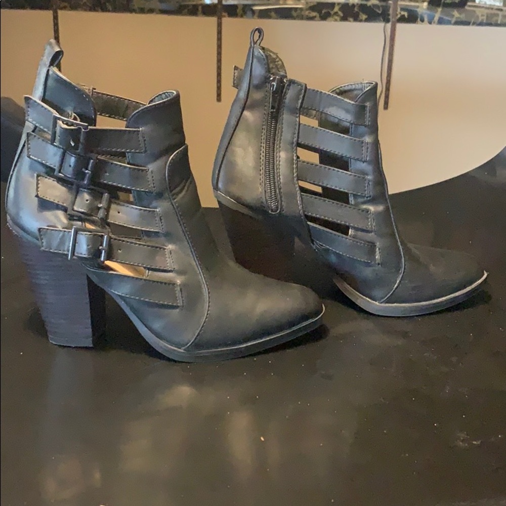 Booties with side, open buckles
